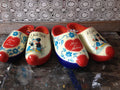 Set of hand-painted Dutch wedding clogs to walk on in a ladies size and a men's size, personal wedding clogs gift