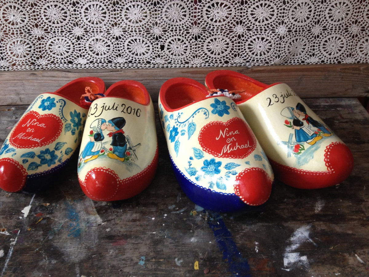 Set of hand-painted Dutch wedding clogs to walk on in a ladies size and a men's size, personal wedding clogs gift