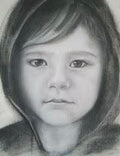 Black and white hand-drawn portrait of a boy in pastel chalk technique, size 29.7:42 cm